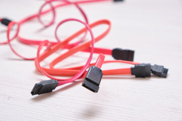 red computer wires for hard drive on light background