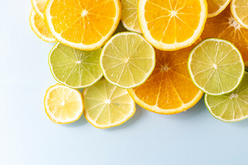 sliced colorful juicy assorted citrus  fruits shot from above flat lay