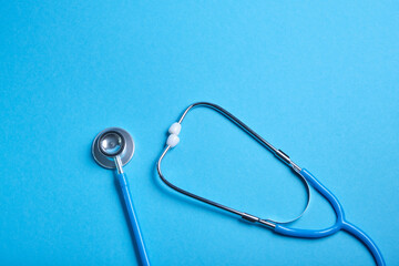 medical stethoscope on blue background, copy place, phonendoscope for diagnosing diseases