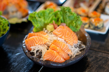 sliced salmon on iced in japanese restaurant