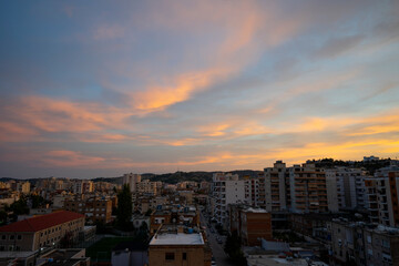 Fototapeta na wymiar The beautiful cityscape of Albanian city Vlore, with cloudy blue sky.