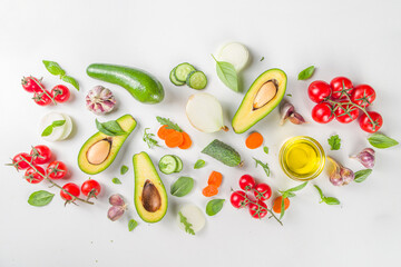 Organic fresh raw vegetables flatlay. Healthy food cooking background with various vegetable salad ingredients.  Vegetarian fresh raw food concept. Top view, copy space