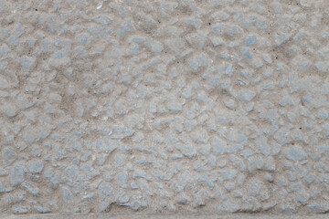 Light grey textured asphalt close up shot