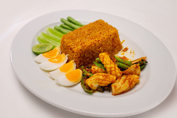 Thai curry paste fried rice with stir fried chili paste with squid and sliced boiled egg