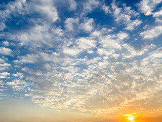 Naklejka na ściany i meble Sunset in the sky with dramatic clouds.