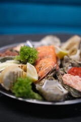 a plate of assorted seafood on a white background close-up