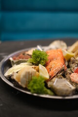 a plate of assorted seafood on a white background close-up