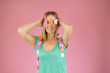 Woman wearing a ribbon of hearts over her eyes