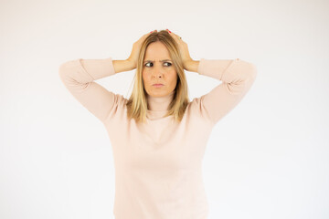 Close up isolated portrait of young annoyed angry woman holding hands in furious gesture.