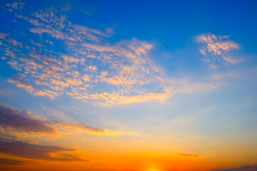 Scenic of sunrise and cloud on the orange sky.