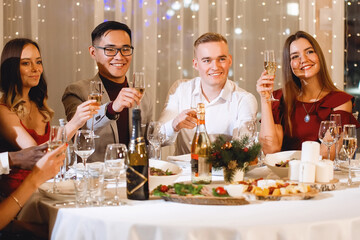 Friends at holiday table.