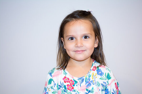 Portrait of a five year old girl making funny faces