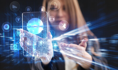 Business, Technology, Internet and network concept. Young businessman working on a virtual screen of the future and sees the inscription: Remarketing