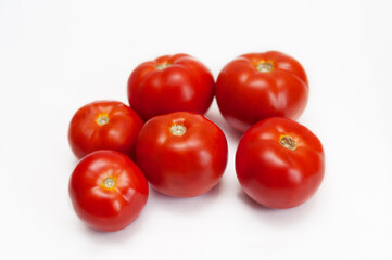 red tomatoes  on a white background. 