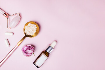 Obraz na płótnie Canvas Skincare accessories on pink background.