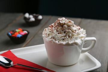 Coffee Con Panna with whipped cream, cacao, and candy