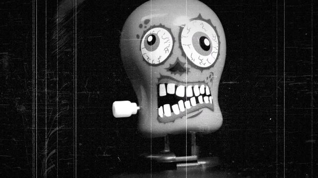 Wind up monster toy walking towards camera