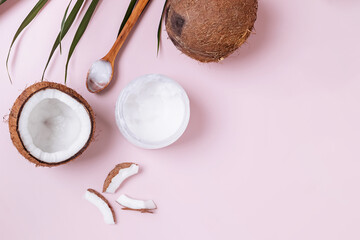 Healthy coconut oil on pink background