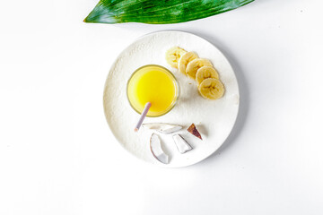 cocktail with coconut on white background top view