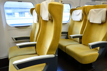 Yellow train seats nobody use