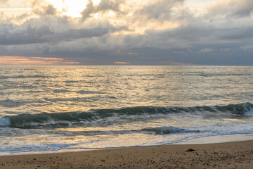 Fototapeta na wymiar Sandy beach along the Atlantic coast in a summer evening.