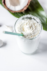 cocktail with coconut on white background