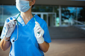 Confident medical practitioner woman outside near clinic