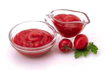 tomato sauce or ketchup in a glass bowl isolated on a white background.