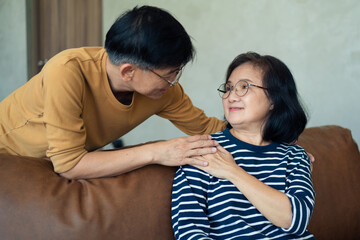 Asian elderly spending time together at home, Senior or mature people stay in the living room at holiday. After retirements lifestyle concept of elderly.