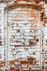 old red brick wall with remnants of plaster and paint, texture, background