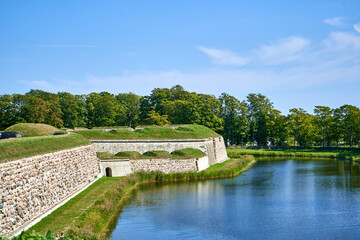 Fototapeta premium Defense wall of the castle and canal around it 