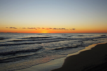 Fototapeta na wymiar Sunrise on the beach a summer day