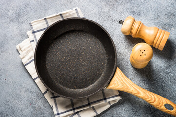 Frying pan or skillet with stone nonstick coating. - obrazy, fototapety, plakaty