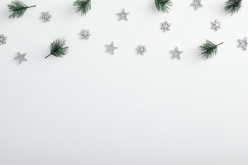 Mock up with pine branch, silver snowflake and star over white