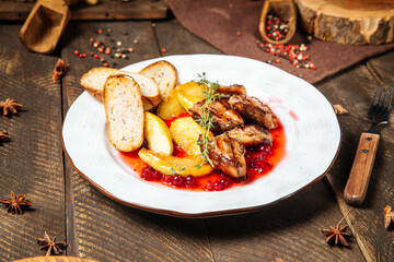 Chicken with potatoes toasts and lingonberry sauce