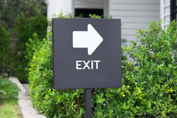 Exit sign on parking area of cafe.