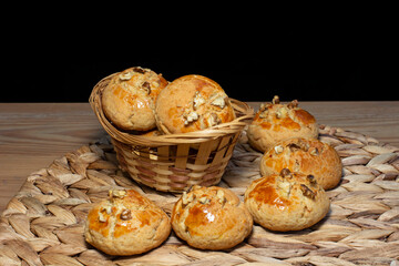 Delicious fried cookies on a straw floor in the basket