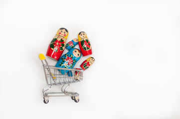 Russian doll. wooden dolls in a basket on a white background
