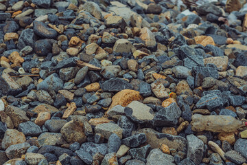 Small and big smooth round pebbles, sea dry stones, multicolour gray gravel. Abstract Composition Textured background. Ideal for web banner design
