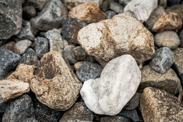 Small and big smooth round pebbles, sea dry stones, multicolour gray gravel. Abstract Composition Textured background. Ideal for web banner design