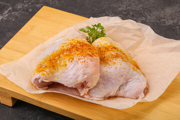 Raw chicken thigh with spices