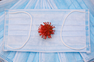 Red virus on the protective mask