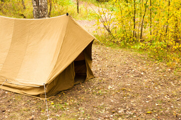 old tent in the autumn forest, home for adventure and travel © vadim yerofeyev