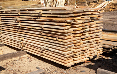 Stack of wooden planks outdoors in a warehouse