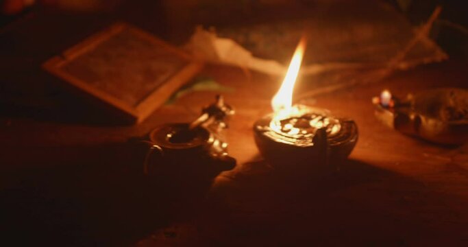View of ancient rushlight lightining on a table.