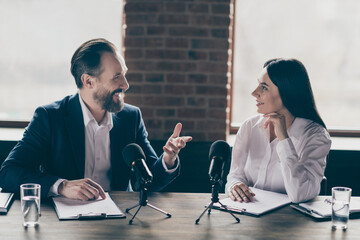 Photo of two business people man lady partners answer journalist press conference questions speak...