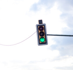 green traffic light with sky semaphore
