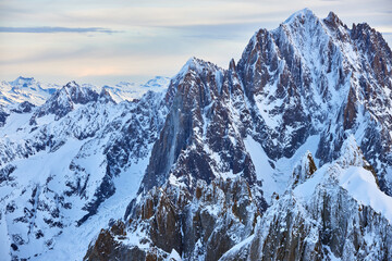 View of the high winter mountains in the evening from Aiguille du Midi.