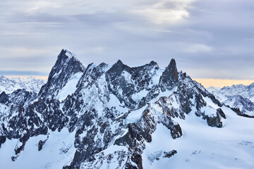View of the high winter mountains in the evening from Aiguille du Midi.