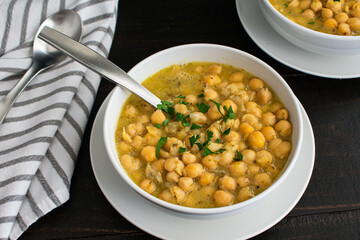 Greek Chickpea Soup With Lemon & Oregano (Revithosoupa): Bowls of Greek soup made with garbanzo beans, lemon, and oregano